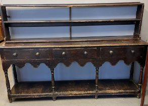 19th century stained pine pot board dresser, the moulded top above an arrangement of three drawers