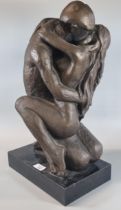 Modern bronzed composition study of two nude figures in an embrace on rectangular base. 50cm high