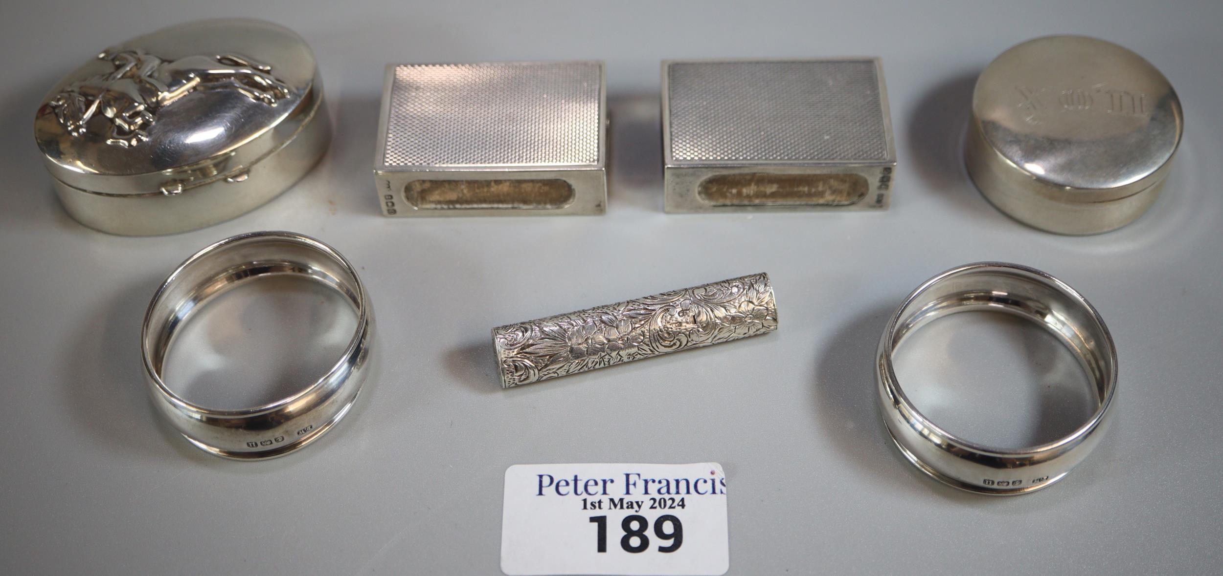 Box of silver to include: two napkin rings, two silver boxes one decorated with jockey and