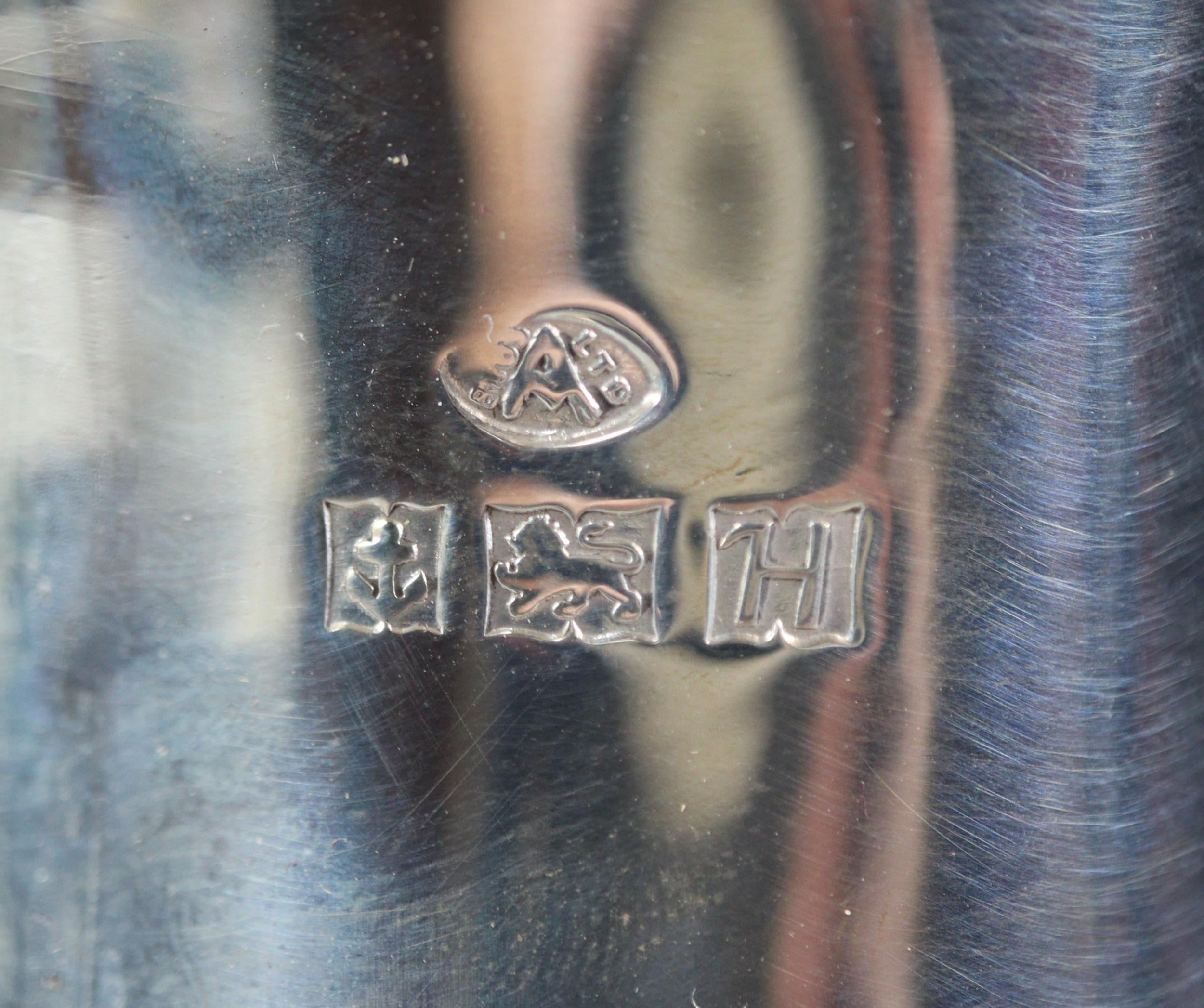 Queen Elizabeth II silver tea service comprising: teapot, two handled sucrier and helmet shaped - Image 2 of 3