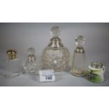 Collection of silver topped and glass scent/cologne bottles, one gilt design together with a