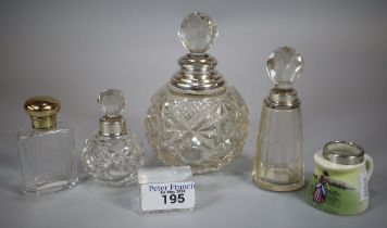 Collection of silver topped and glass scent/cologne bottles, one gilt design together with a