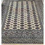 Middle Eastern design, probably Pakistan, beige ground Bokhara rug. 160x227cm approx. (B.P. 21% +