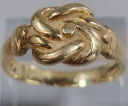 9ct gold knot design ring. 6.9g approx. Size T1/2. (B.P. 21% + VAT)