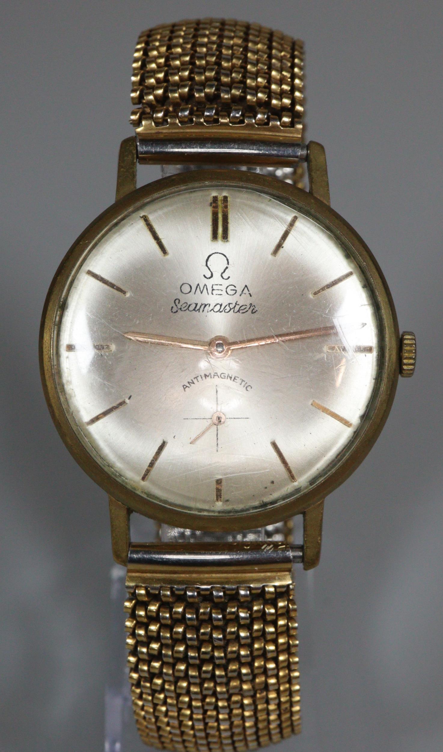 Yellow metal gentleman's wristwatch with satin face having seconds dial on a gold