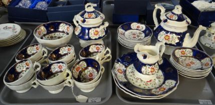Two trays of 19th Century Gaudy Welsh 'Floret' design teaware to include: teapot, plates, jug,