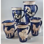 Sally Seymour (Penfro), a collection of five Welsh studio pottery jugs depicting: roosters, cow,