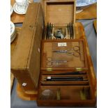 Tray of wooden boxed items to include: C. Baker 244 High Holborn, London, surgeon's boxed set