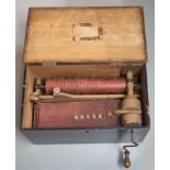 Mechanical music, a wooden hurdy gurdy type bellows organ playing tunes on a wooden drum with