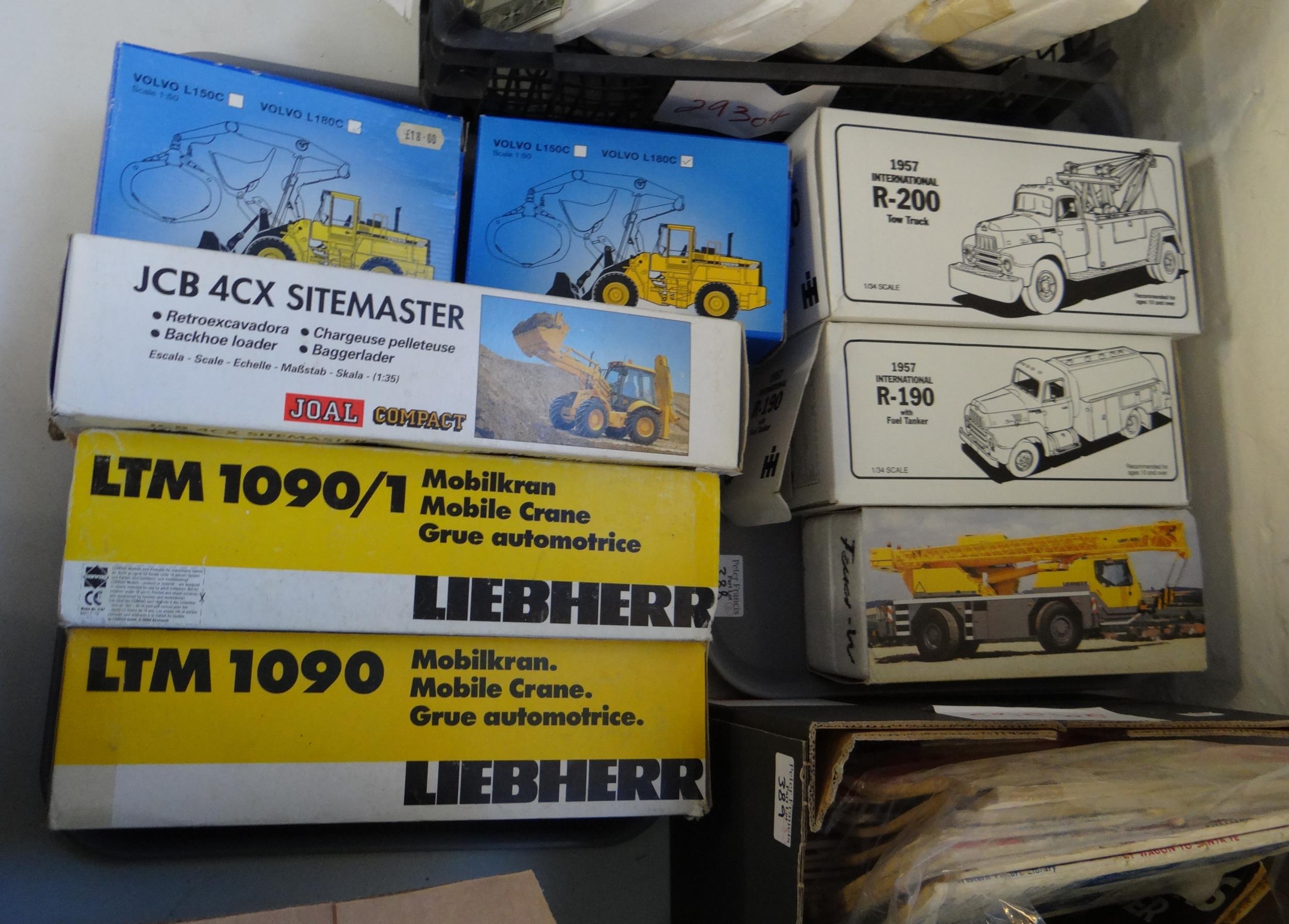 Two trays Liebherr First Gear 1:34 scale etc. diecast model vehicles to include 1957 International