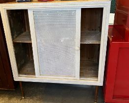 Early 20th century meat safe on later tapering legs, with mesh sliding doors and panels.
