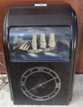 Mid century brown Bakelite Vitascope Industries Ltd electric automaton clock with rocking three