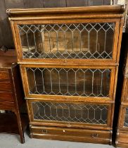 Early 20th century oak Globe Wernicke style leaded and glazed three sectional bookcase with under