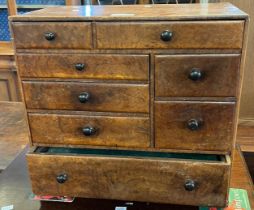 19th century maple table top collector's cabinet, having an arrangement of eight drawers with
