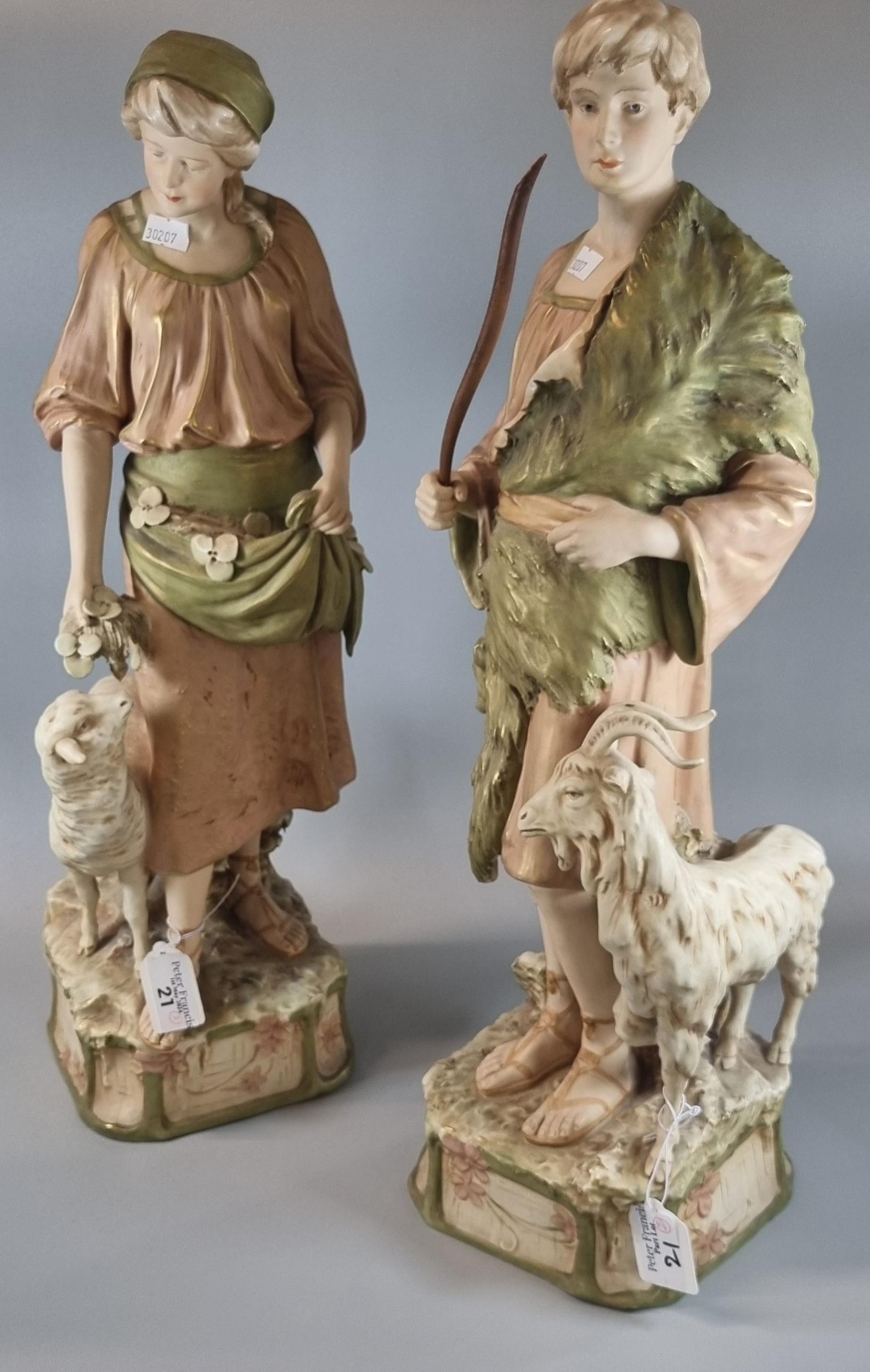 Pair of early 20th century Royal Dux figurines of a Shepherd (goat herder) and shepherdess.