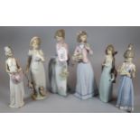 Collection of six Spanish porcelain Lladro figurines to include: girl with umbrella and dove,