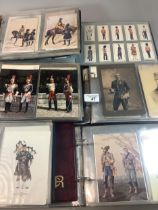 Collection of military postcards, photographs and cigarette cards in six albums, 100s, interesting