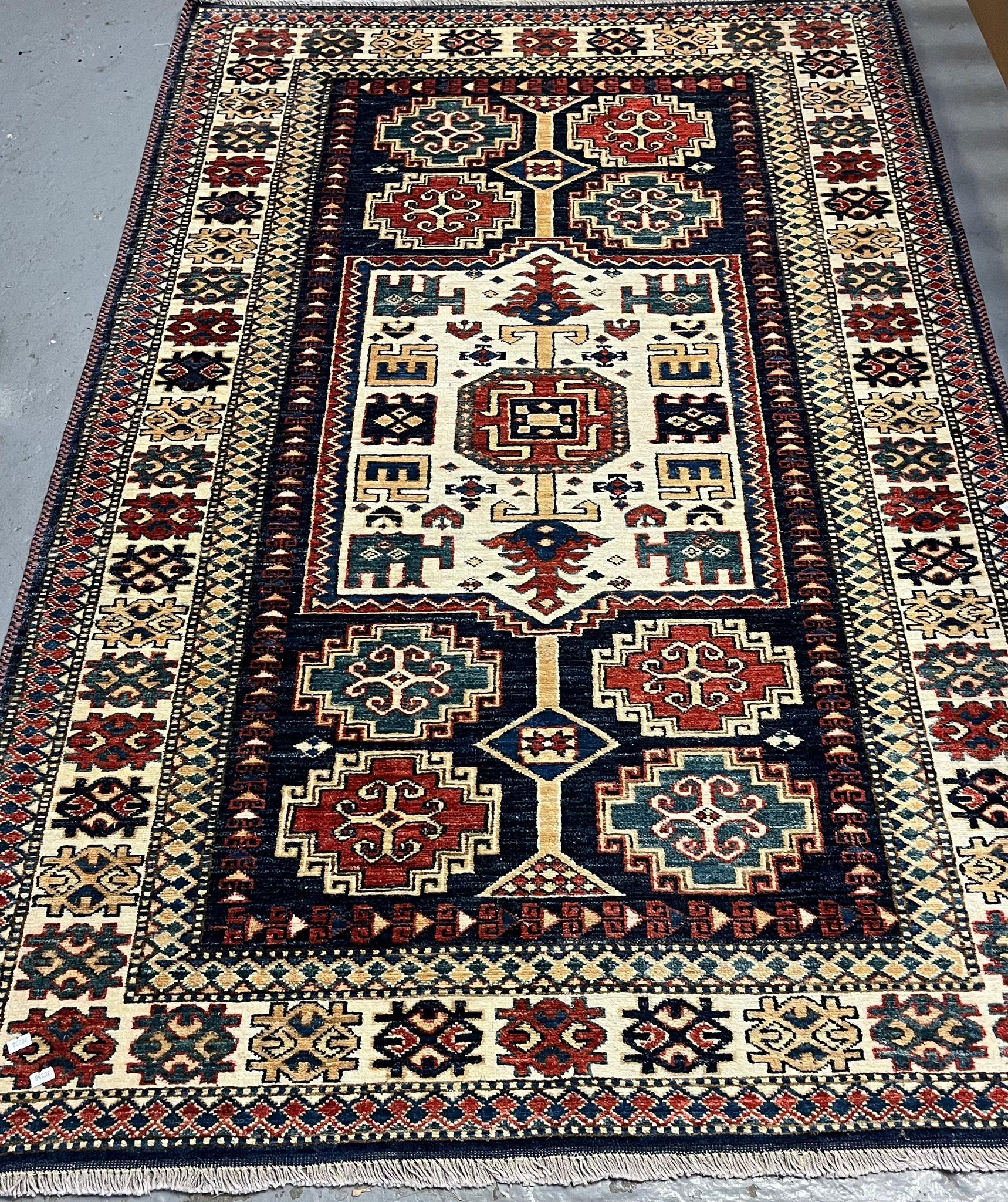 Vintage Afghan tribal design multi-coloured rug. 190x120cm approx. (B.P. 21% + VAT)