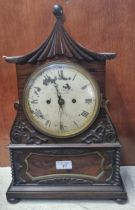 Early 19th century rosewood pagoda shaped two train mantel clock, having painted Roman face marked