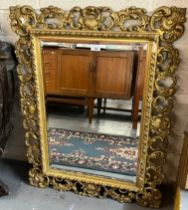 19th century gilt framed Florentine design bevelled plate mirror. 92x70cm approx. (B.P. 21% + VAT)