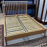 Modern Ercol pale oak Teramo four foot six inch double bed with slats, together with a pair of Ercol