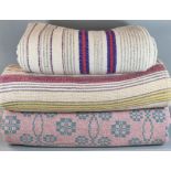 Three vintage woollen blankets or carthen to include: two striped narrow loom and a pink and cream