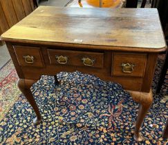 19th century oak lowboy, the moulded and shaped top above an arrangement of three drawers standing