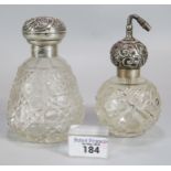 Silver topped and cut glass ladies scent bottle with repoussé decoration together with another