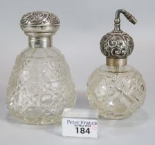 Silver topped and cut glass ladies scent bottle with repoussé decoration together with another