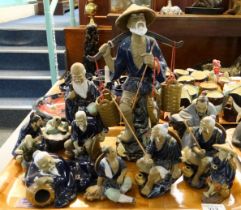 Tray of modern Chinese mudmen style figures, mainly fishermen. One has sticker for Shiwan Artistic
