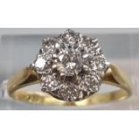 18ct gold diamond nine stone flowerhead cluster ring. 3.7g approx. Size M. (B.P. 21% + VAT) the