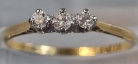 18ct gold and platinum three stone diamond ring in white Bakelite ring box marked 'James Allan