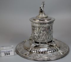 An Elkington's Greek revival silverplated capstan shaped inkwell with figural cover, frieze of