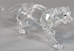 Swarovski Crystal study of a striding female lioness in original tubular box. (B.P. 21% + VAT)