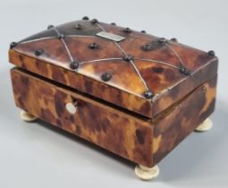 19th century tortoiseshell snuff box with metal studs and geometric stringing to the domed cover,