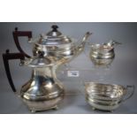 Queen Elizabeth II silver tea service comprising: teapot, two handled sucrier and helmet shaped