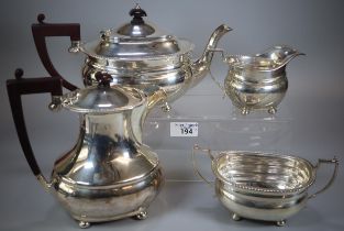 Queen Elizabeth II silver tea service comprising: teapot, two handled sucrier and helmet shaped