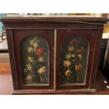 19th century mahogany table top two door collector's cabinet with painted panels of flowers and