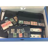All World selection of mint and used stamps in blue boxfile, mostly on black cards and packets and