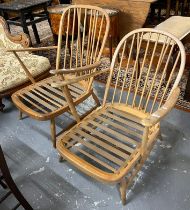 Two similar elm and beech Ercol spindle back armchairs (missing their cushions). (2) (B.P. 21% +