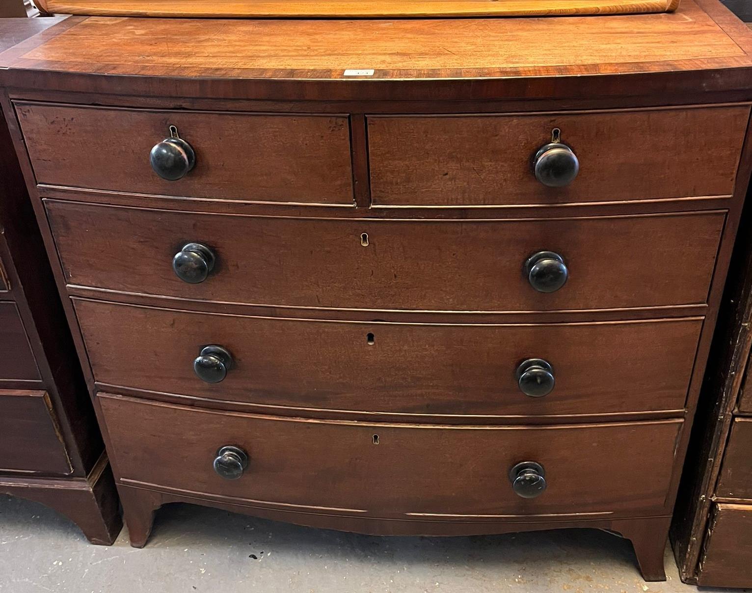 Victorian mahogany bow front chest of two short and three long cock beaded drawers with turned