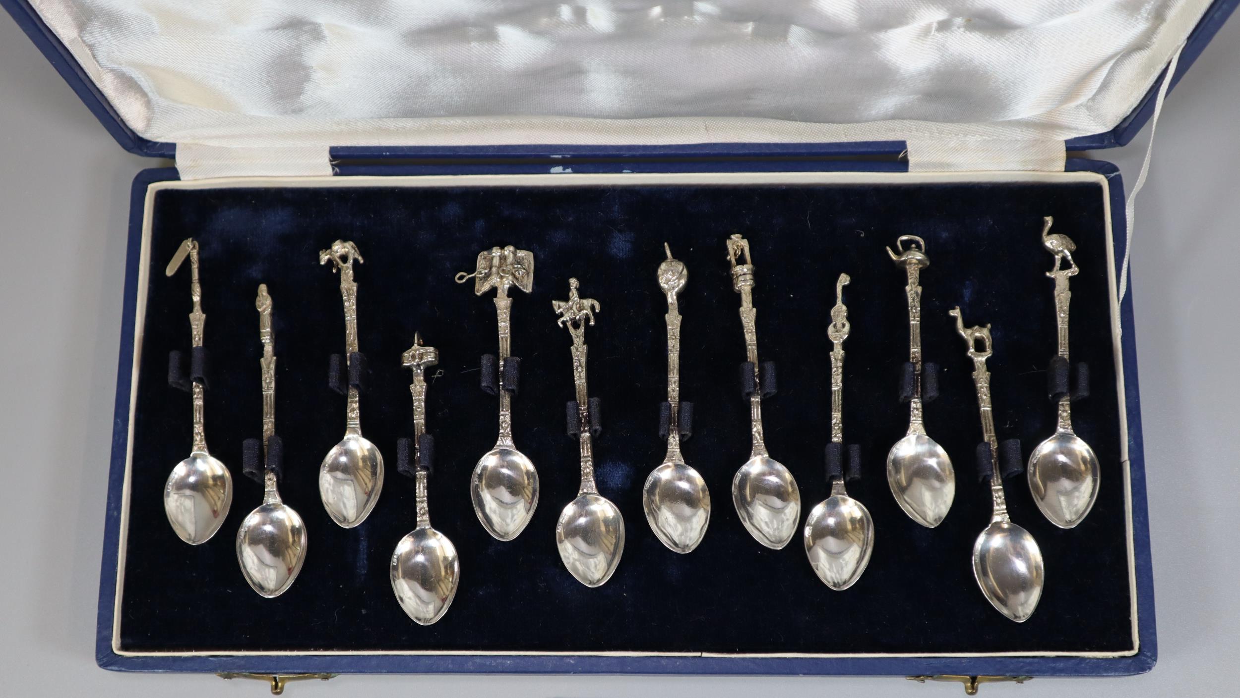 Set of South American (Argentinian) silver coffee spoons with various symbolic terminals. cased. (