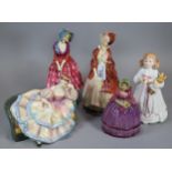 Four Royal Doulton figurines to include: 'Bunny's Bedtime' HN3370, 'Pauline' HN2441, 'Paisley Shawl'