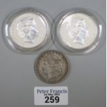 Queen Elizabeth II silver one Dollar piece dated 2000 (2), together with an 1879 USA silver