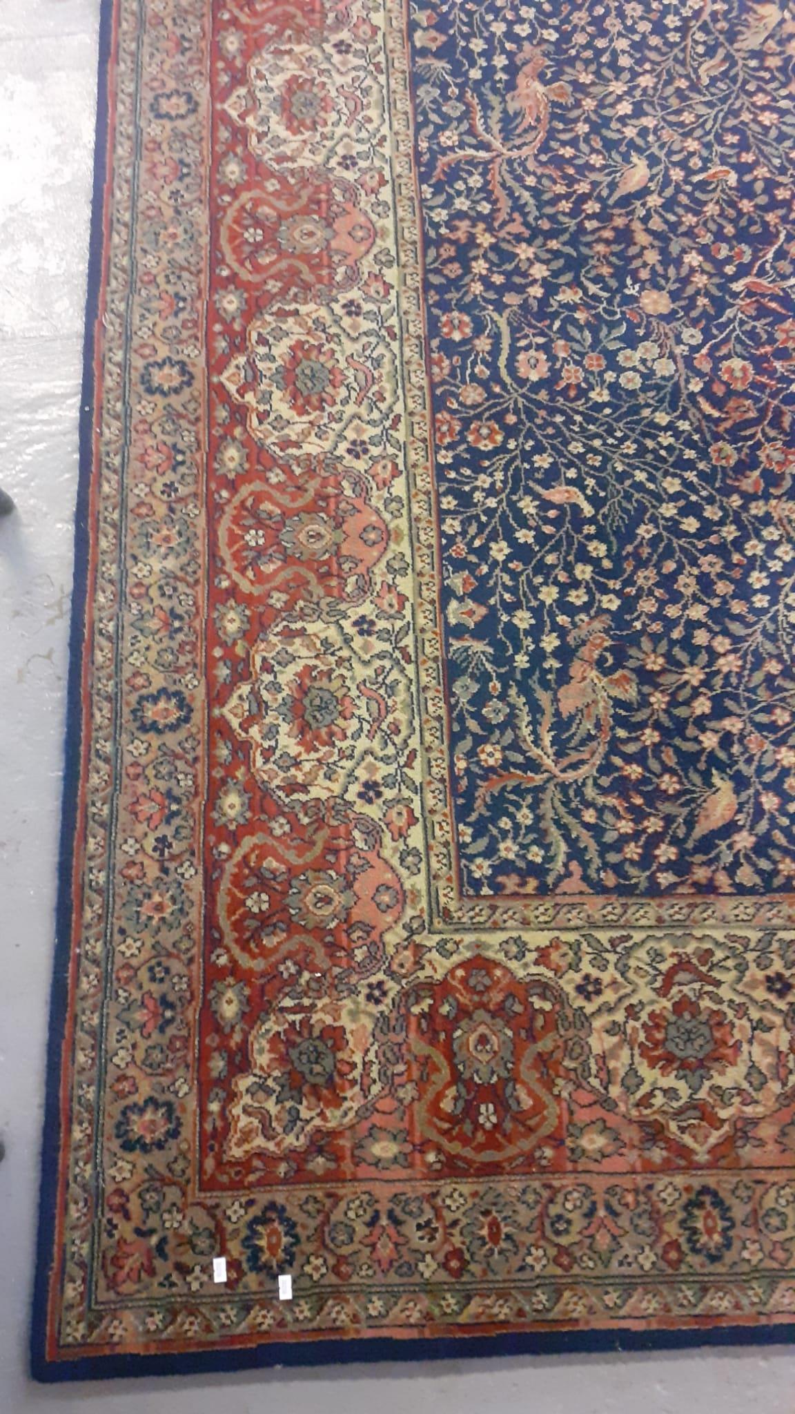 Large Persian style Axminster type carpet with dark blue field, birds, animals and foliage. - Image 2 of 2