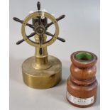 Brass model of a ship's wheel together with an oak dwarf baluster candlestick bearing label 'from