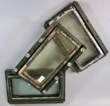 Group of three heavy and thickly glazed Ferret armoured car side viewing ports with metal frames. (