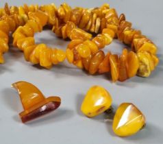 Amber butterscotch necklace (60g approx.) together with a pair of amber clip-on earrings and a