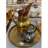 Middle Eastern design embossed brass circular tray , a brass and copper ewer and a metal kettle. (3)