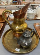 Middle Eastern design embossed brass circular tray , a brass and copper ewer and a metal kettle. (3)